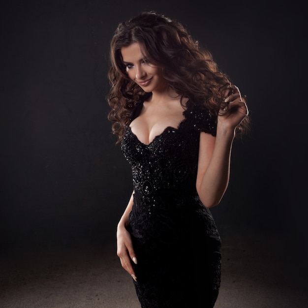 Portrait of a young attractive woman with gorgeous curly hair. Attractive brunette