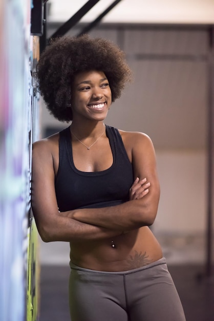 portrait of a young beautiful African American women in sports clothes after a workout at the gym