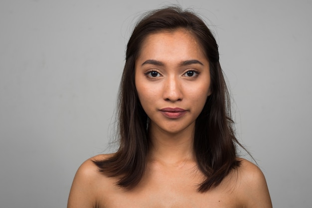 Portrait of young beautiful Asian woman shirtless