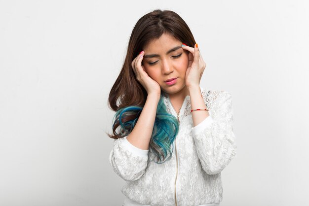 Portrait of young beautiful Asian woman with dyed hair