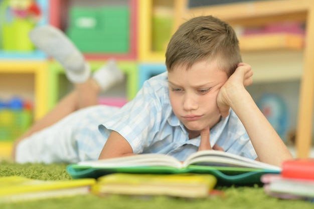 Portrait of young beautiful boy doing homework