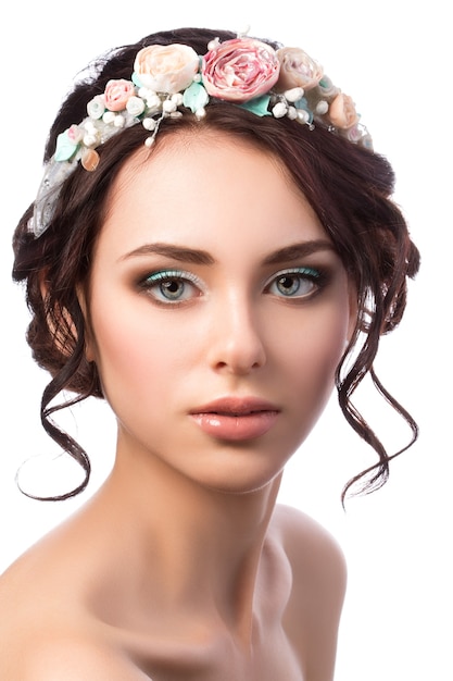 Portrait of young beautiful bride. Wedding coiffure and make-up.