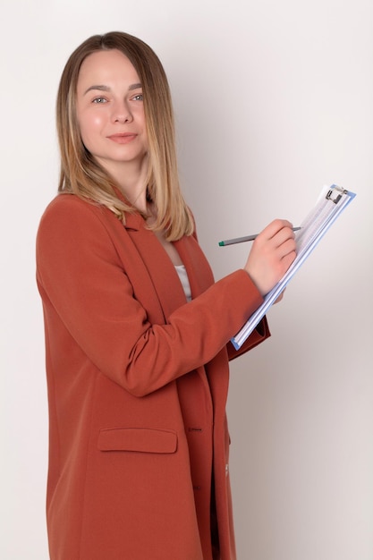 Portrait of young beautiful business woman in the office