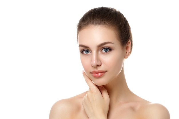 Portrait of young beautiful caucasian woman touching her face isolated over white background.