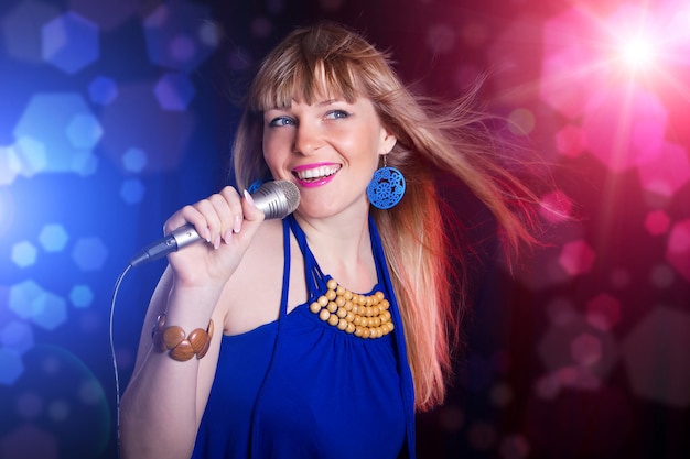 Portrait of young beautiful girl singing