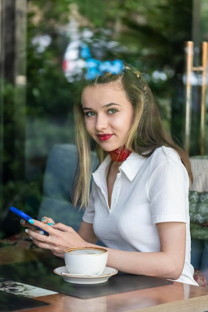 Portrait of young beautiful lady at the restaurant