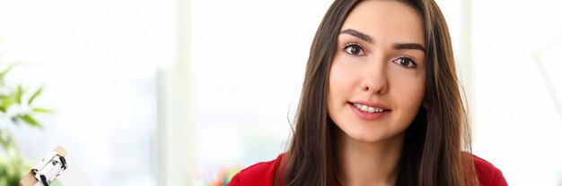 Portrait of young beautiful smiling brunette woman