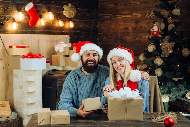 Portrait of a young beautiful smiling couple Winter holidays and people concept Beautiful Couple dre