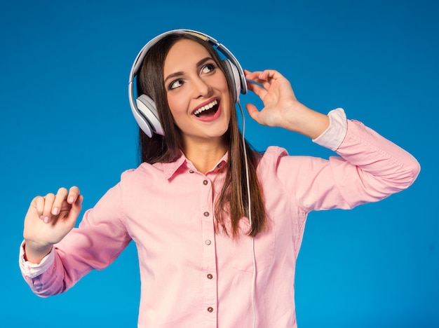 Portrait of a young beautiful woman listening to music.