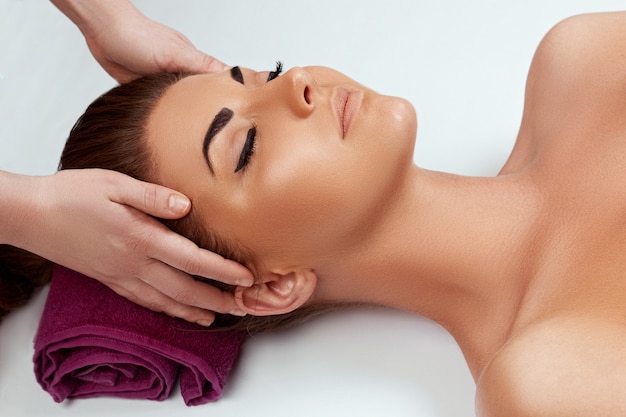 Portrait of Young Beautiful Woman in Spa Salon