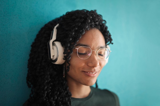 portrait of young beautiful woman while listening to music