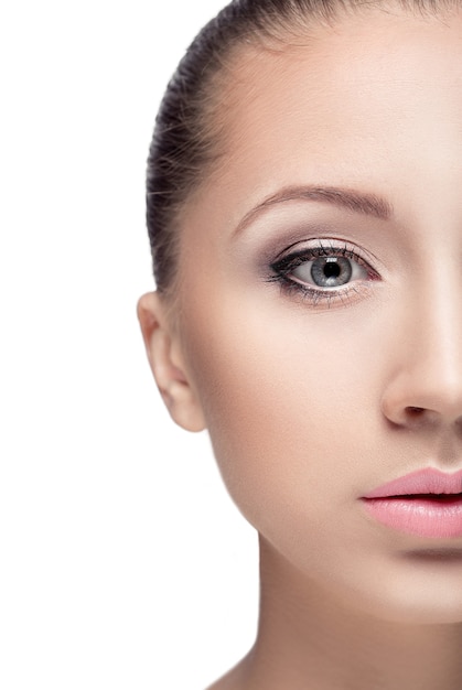 Portrait of young beautiful woman with brown eyes isolated on a white. everyday makeup