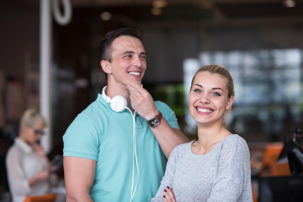 Portrait of young business people discussing business plan  in the startup office