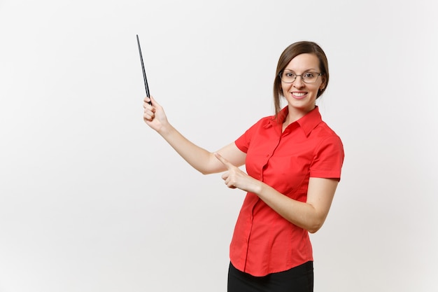 Portrait of young business teacher woman in red shirt skirt glasses holding wooden classroom pointer on copy space isolated on white background. Education teaching in high school university concept.