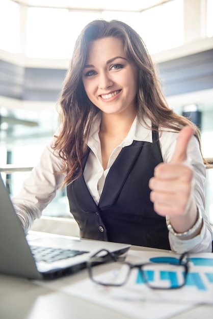 Portrait young business woman working in a modern office.