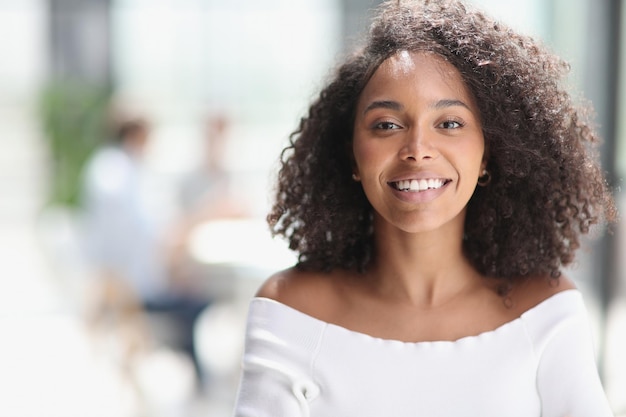 Portrait of young business woman working in the office