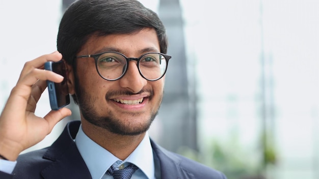 Portrait of a young businessman talking on the phone