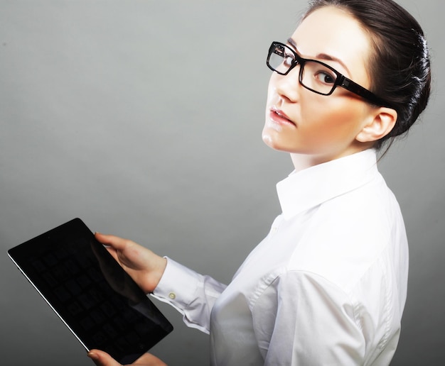 Portrait of a young businesswoman using tablet