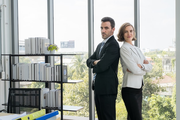 Portrait A young caucasian business couple in their office