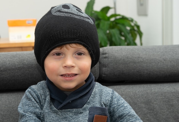 Portrait of a young child with a winter hat