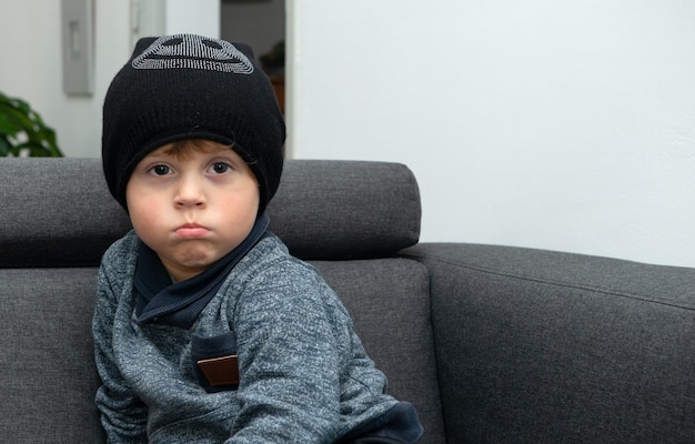 Portrait of a young child with a winter hat