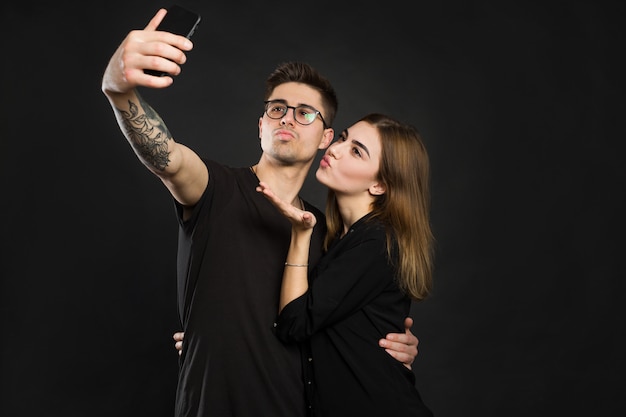 Portrait of young couple in black clothes