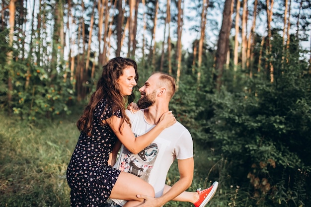 portrait of a young couple in the forest