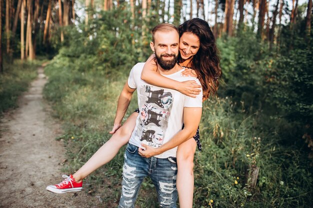 portrait of a young couple in the forest