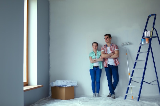 Portrait of young couple moving in new home Young couple