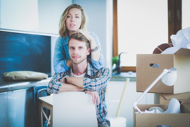 Portrait of young couple moving in new home