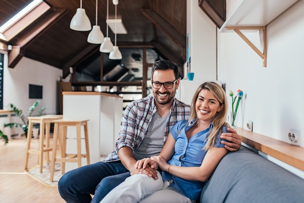 Portrait of a young couple in new apartment.