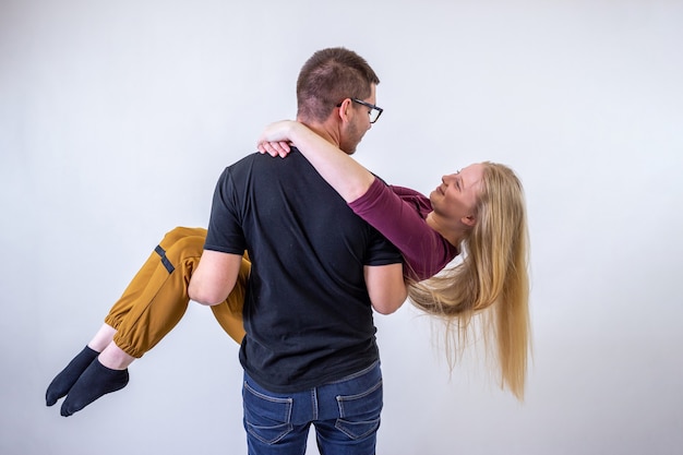 Portrait of young couple on white background