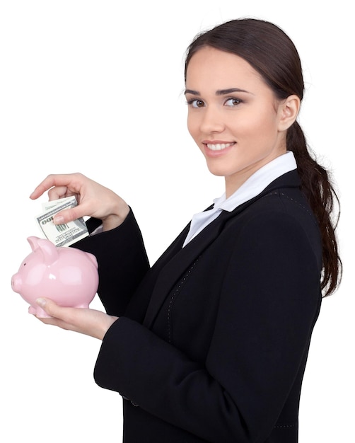 Portrait of young cute business woman with piggy bank isolated on white background