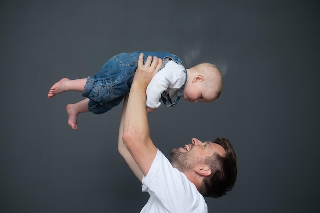 Portrait of young father hugging his little daughter