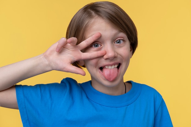 Portrait of young girl covering her eye