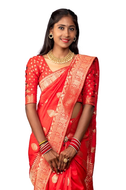 Portrait of a young girl on Indian traditional saree posing on a white background