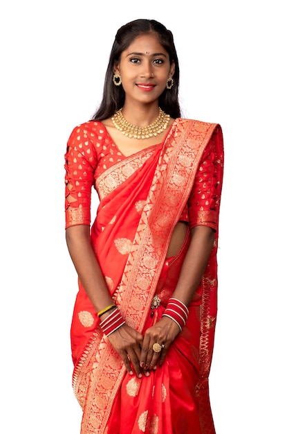 Portrait of a young girl on Indian traditional saree posing on a white background