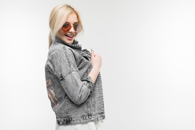 Portrait of young girl in sunglasses isolated on background