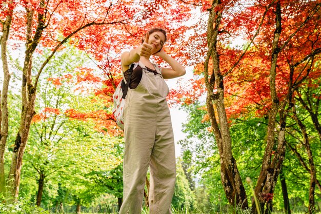 Portrait of young girl with positive emotions in natural nature