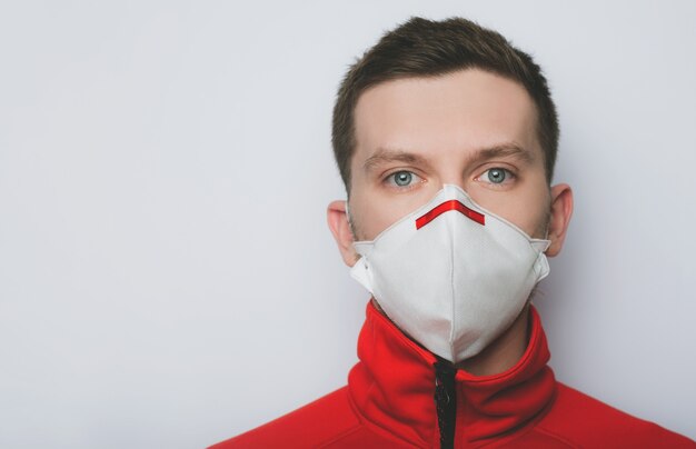 Portrait of a young guy in a medical mask