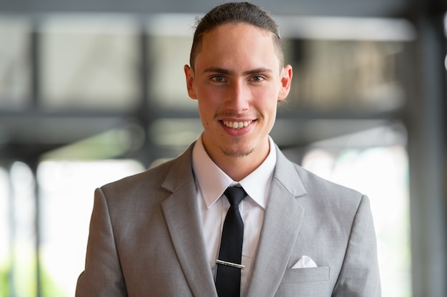 Portrait Of Young Handsome Businessman In Bangkok Thailand