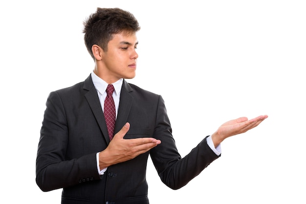 Portrait of young handsome businessman showing something