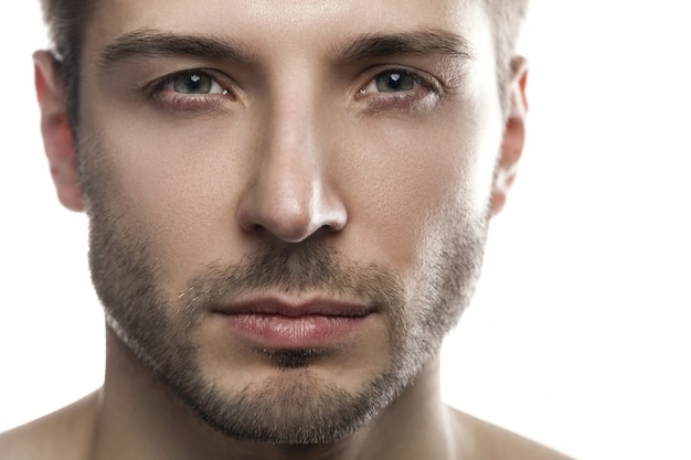 Portrait of young handsome man on white background