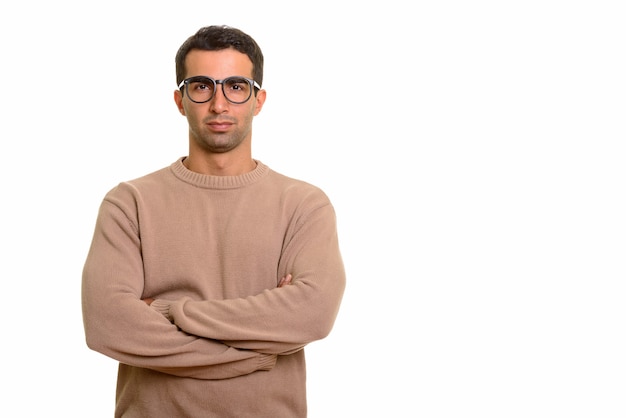 Portrait of young handsome Persian man with nerdy eyeglasses