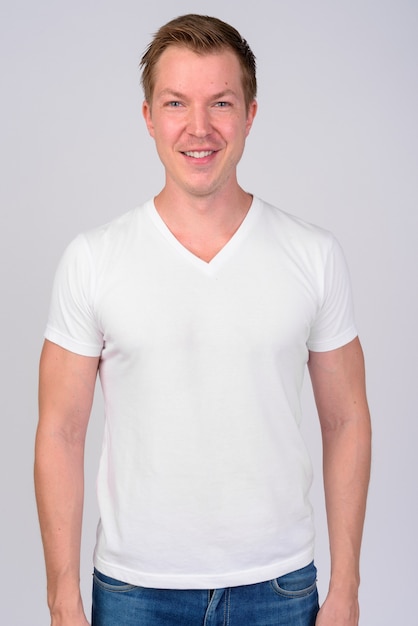 Portrait of young handsome Scandinavian man on white