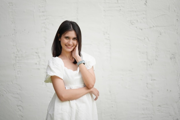 Portrait of young happy woman looks in camera