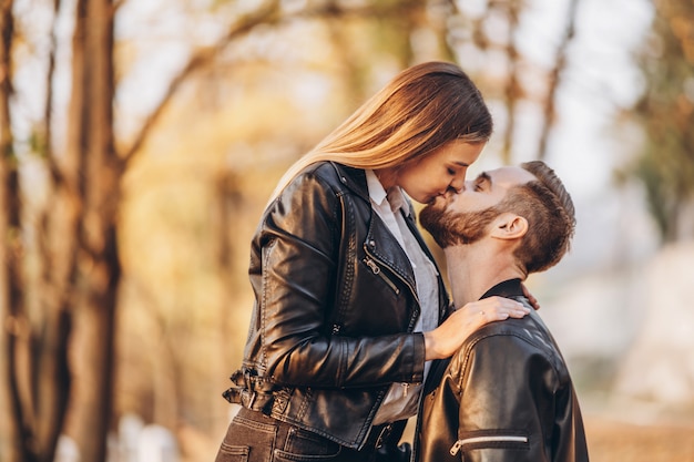 Portrait of a young loving couple hugging and kissing