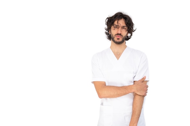 Portrait of a young male nurse in a white uniform isolated on white background Healthcare concept