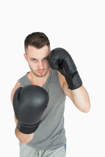 Portrait of young man in boxing stance