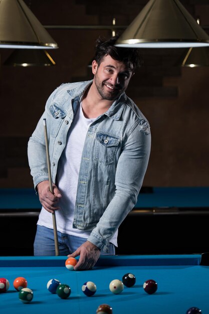 Portrait Of A Young Man Playing Billiards